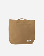Khaki tan coloured tote bag with a visible brand label on a white background