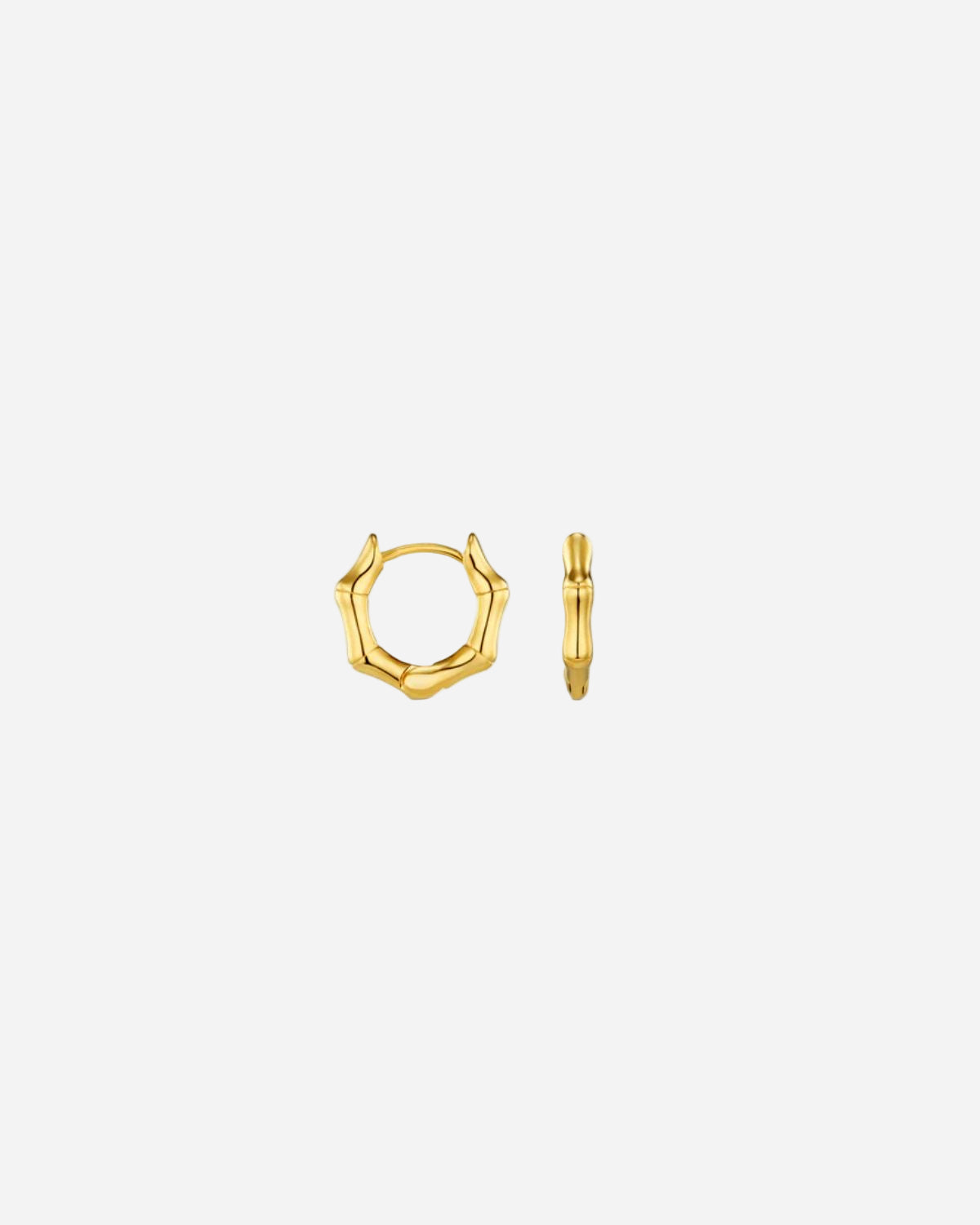 Gold hoop earrings on a white background