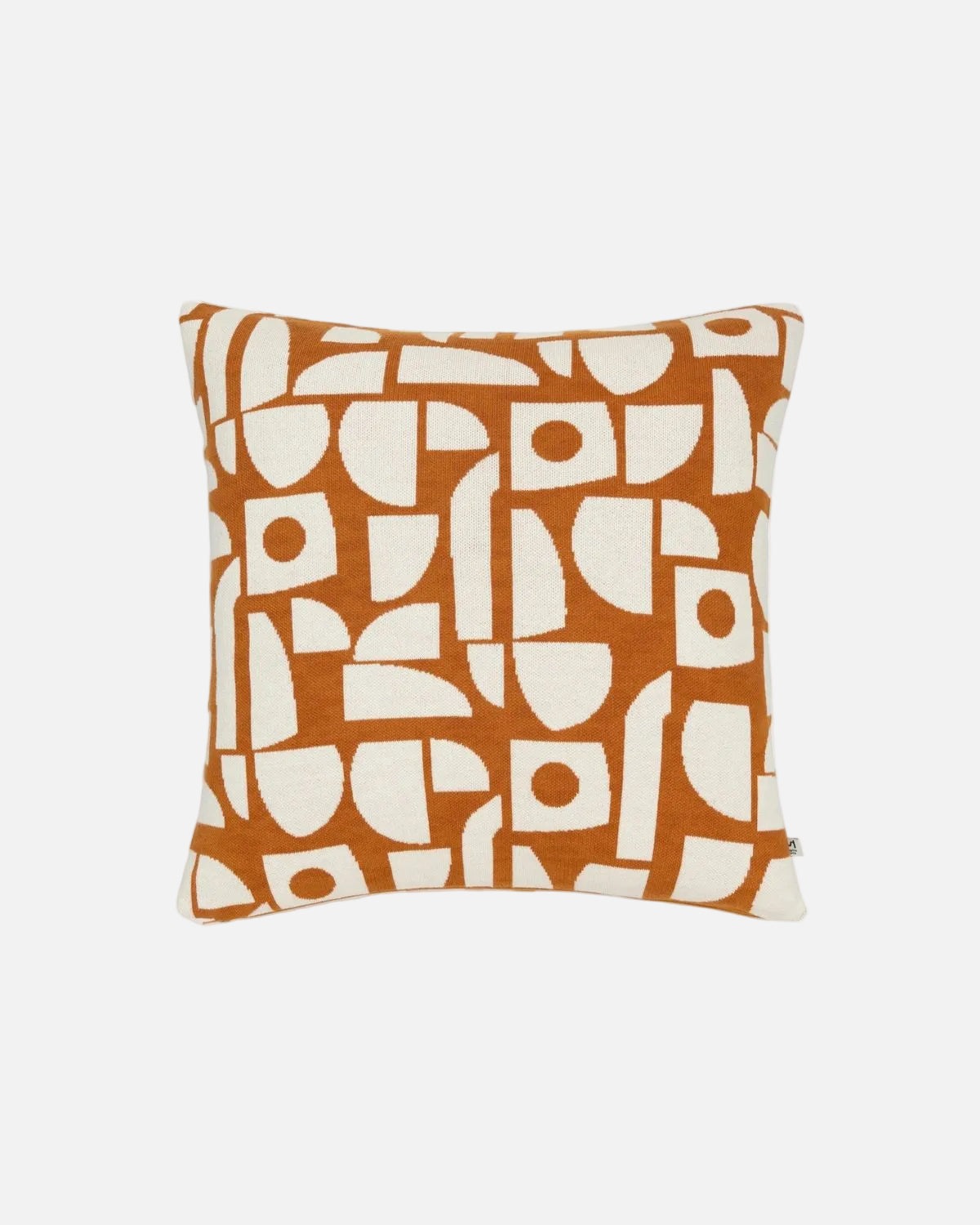 A square throw pillow featuring an abstract geometric pattern in terracotta orange and cream, set against a plain white background.