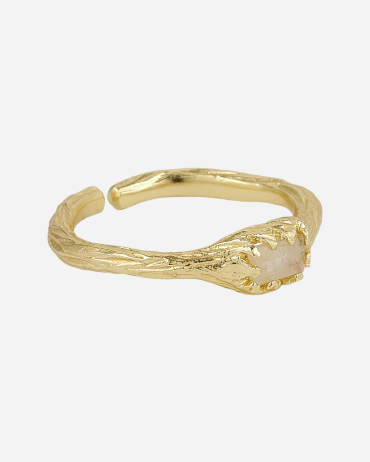 Gold ring with a central stone on a white background