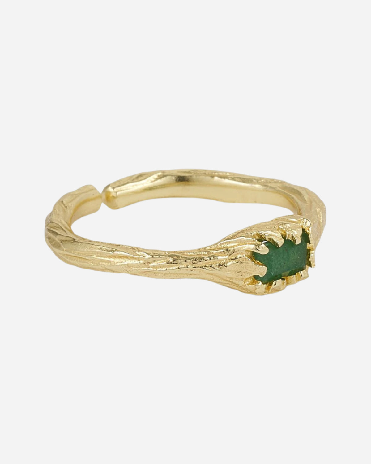 Gold ring with a green gemstone on a white background