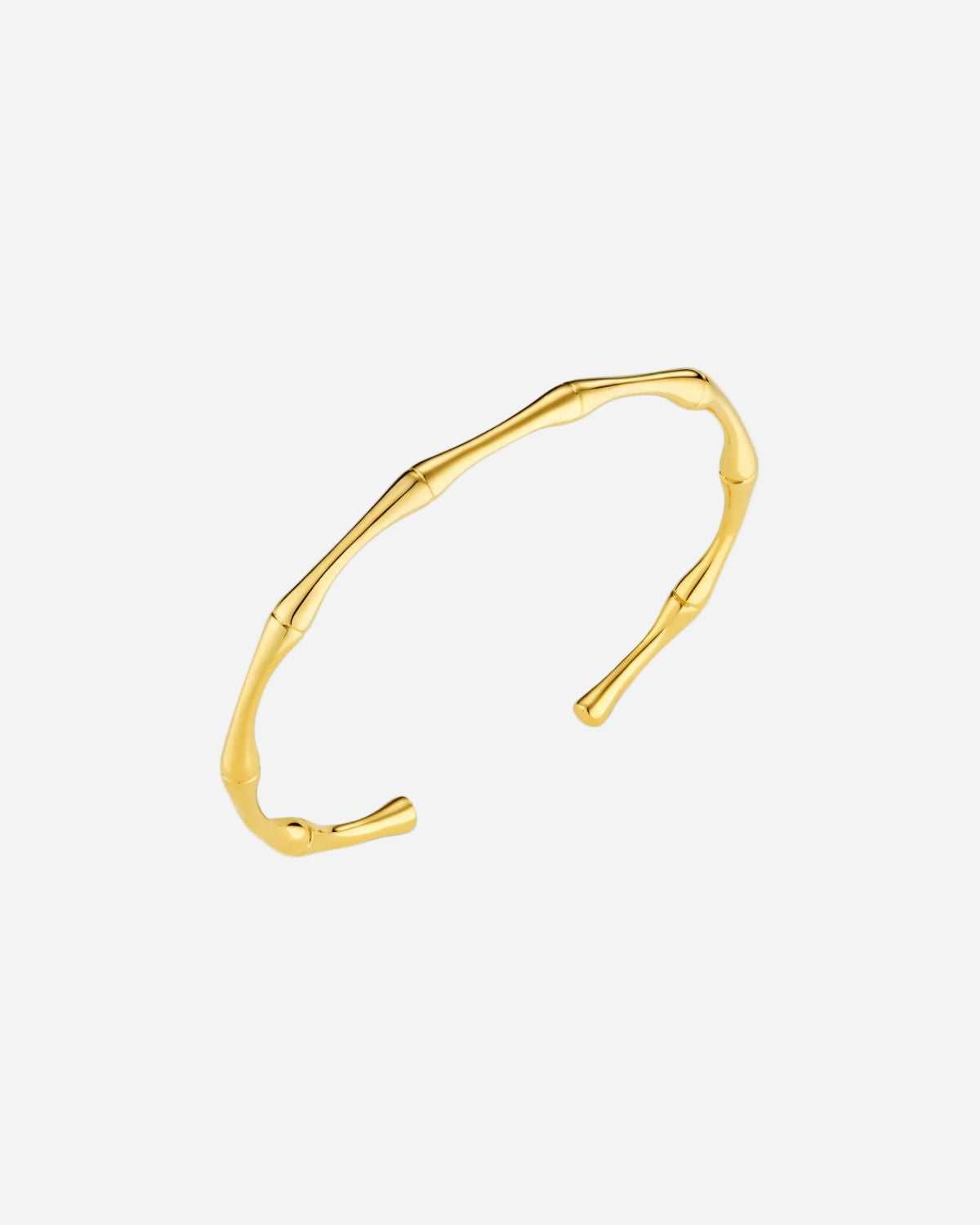 Gold bangle on a white background