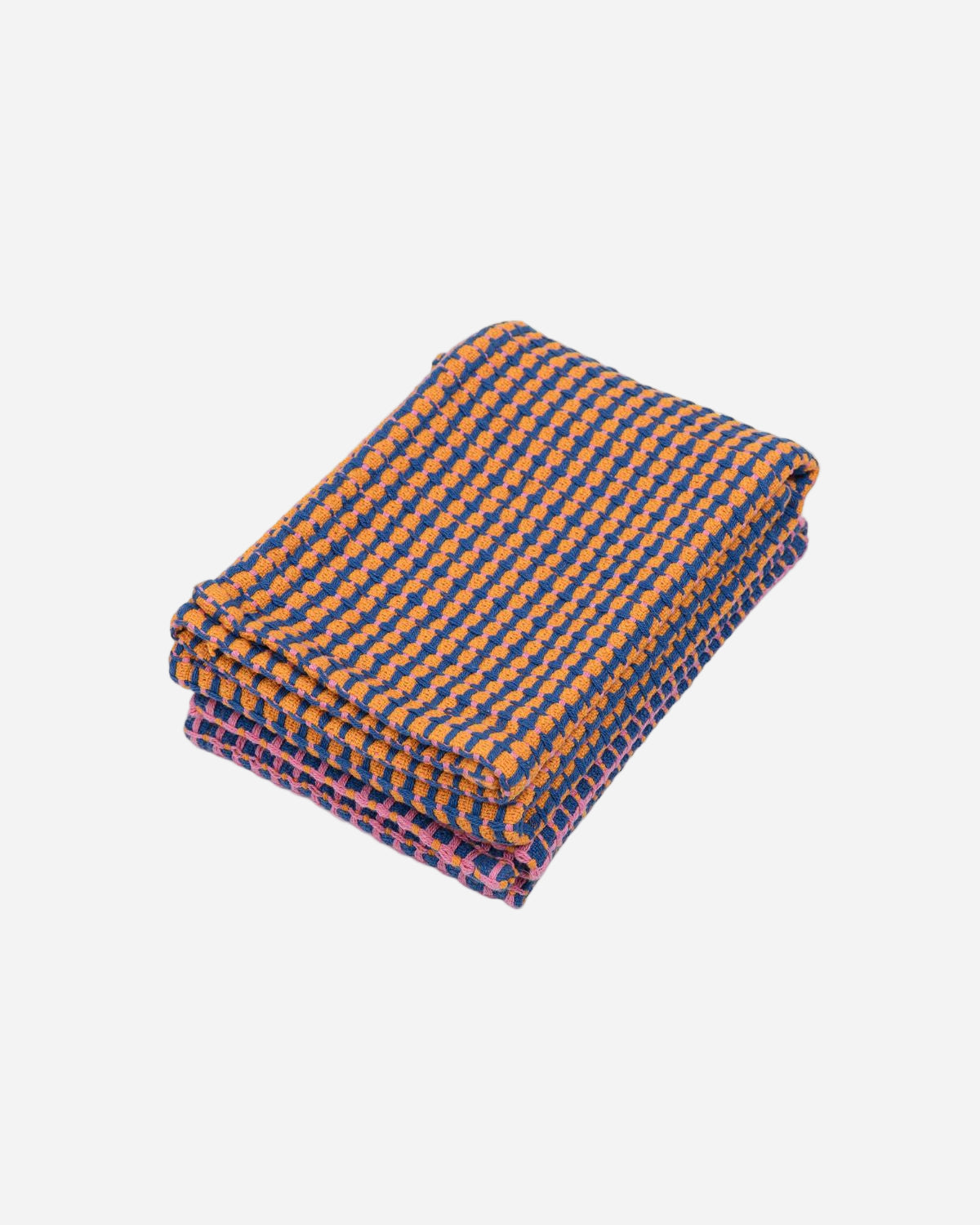 Folded fabric with blue and orange checkered pattern on a white background