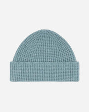 Light blue knit beanie on a white background