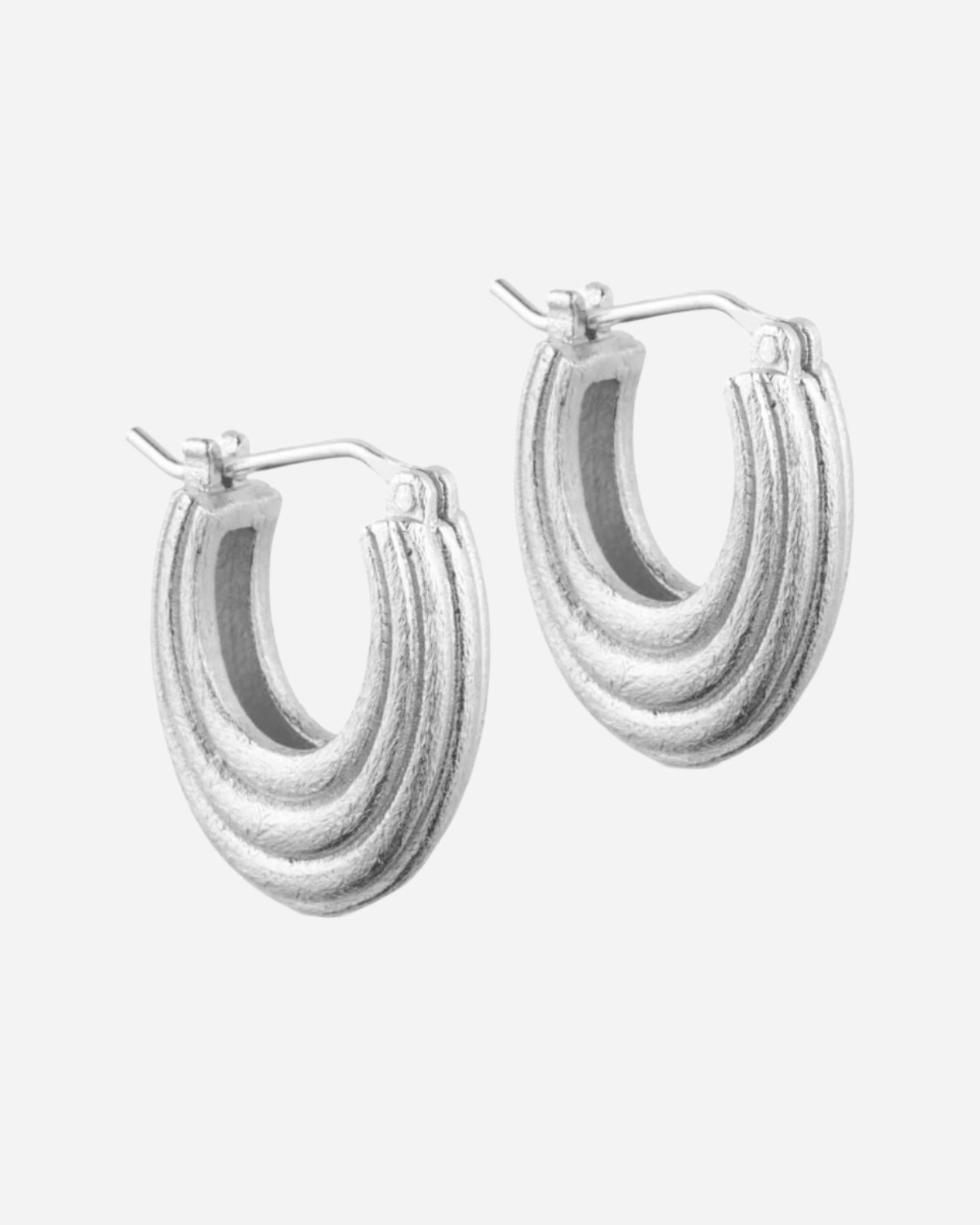 Silver hoop earrings on a white background