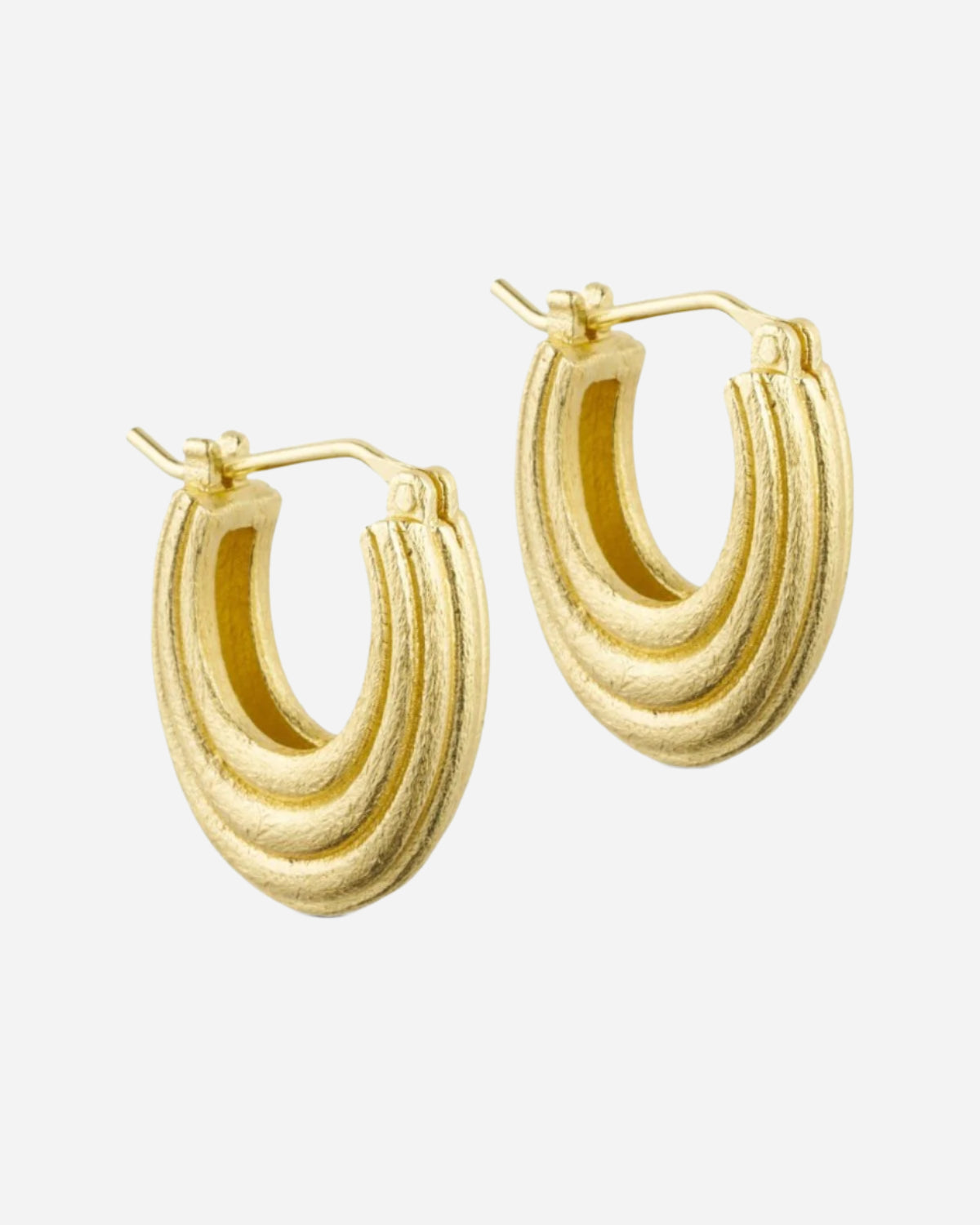Gold hoop earrings on a white background