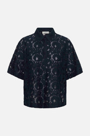 A short-sleeve button-up shirt in navy lace, featuring an intricate floral pattern and a pointed collar, shown against a plain white background.