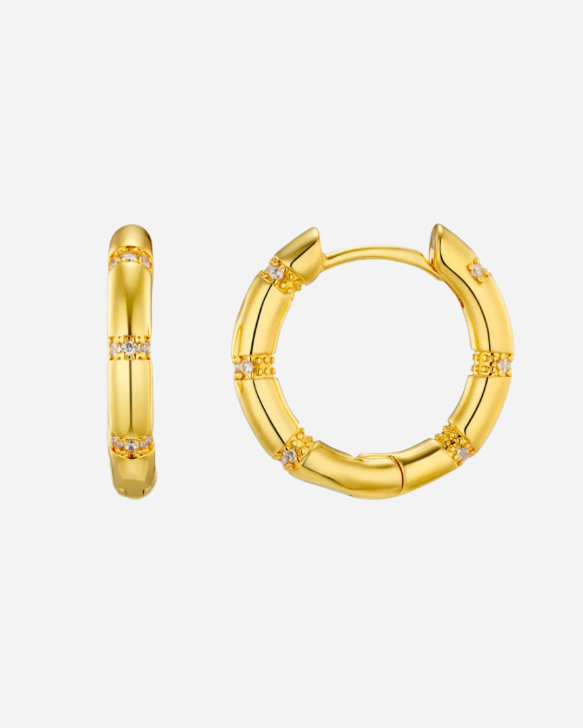Gold hoop earrings with small diamonds on a white background