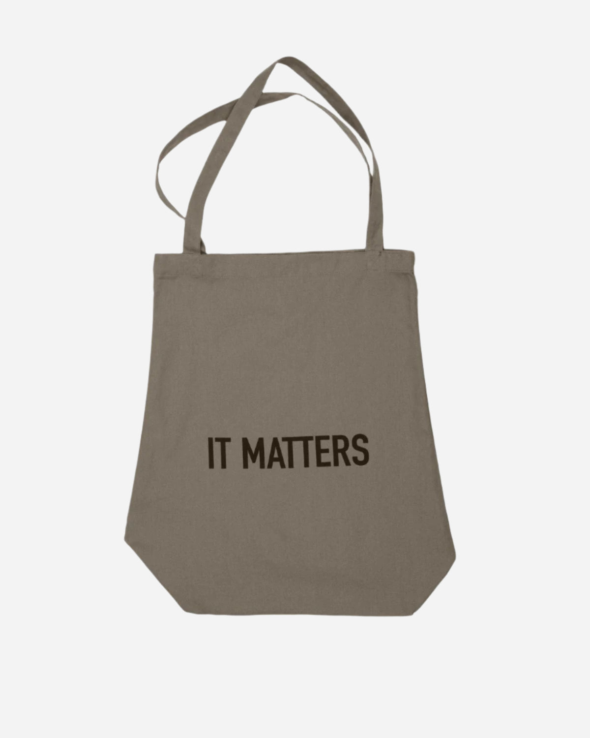 Clay coloured tote bag with 'IT MATTERS' text on a white background