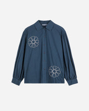 Blue shirt with white floral patterns on a white background