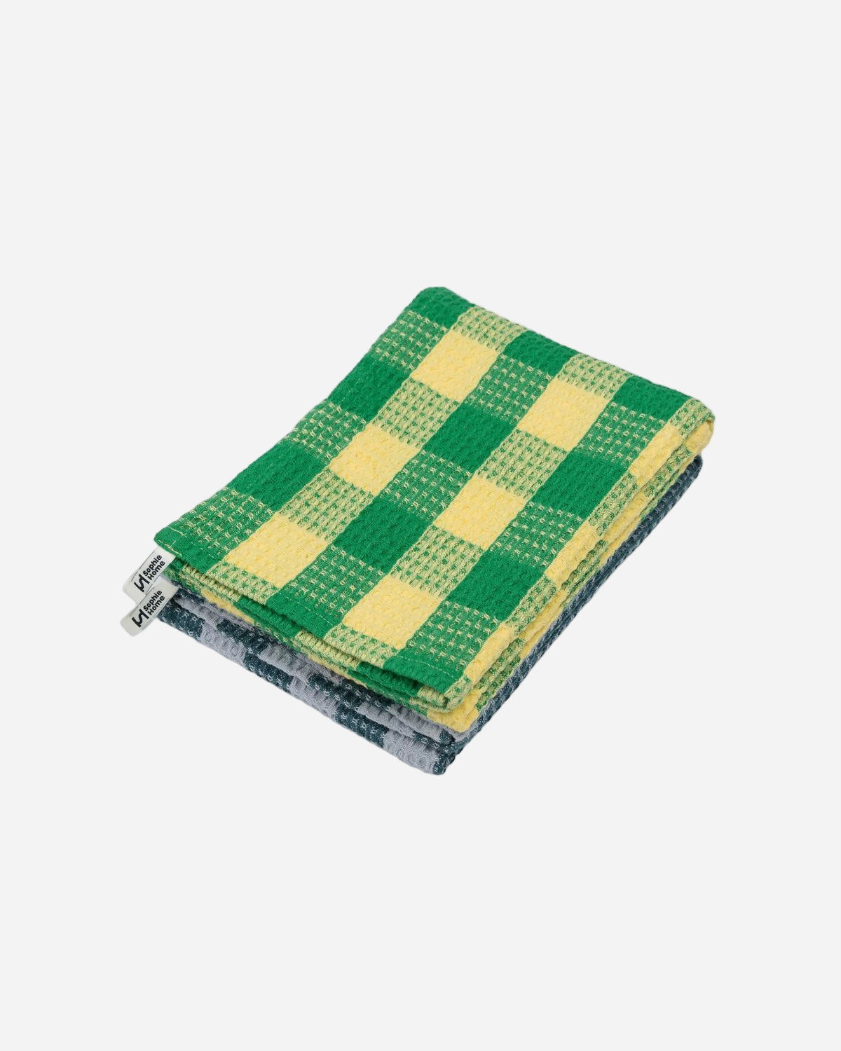 Stack of green and yellow checkered cloths on a white background
