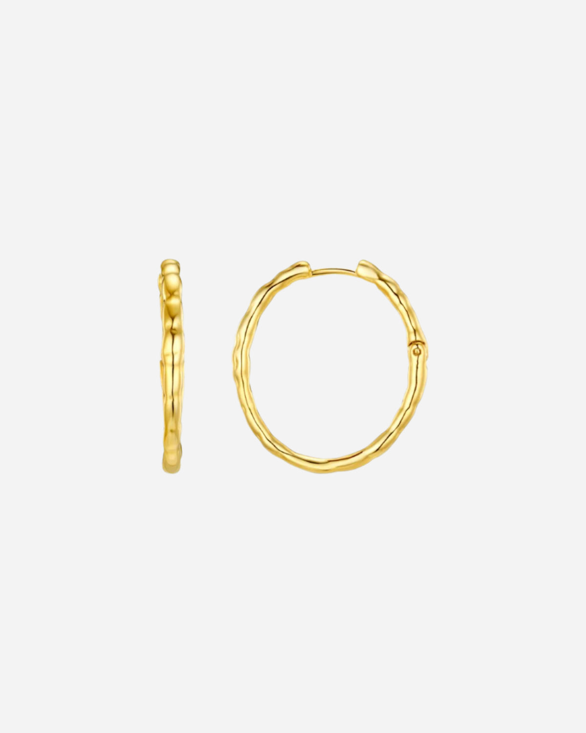 Gold hoop earrings on a white background