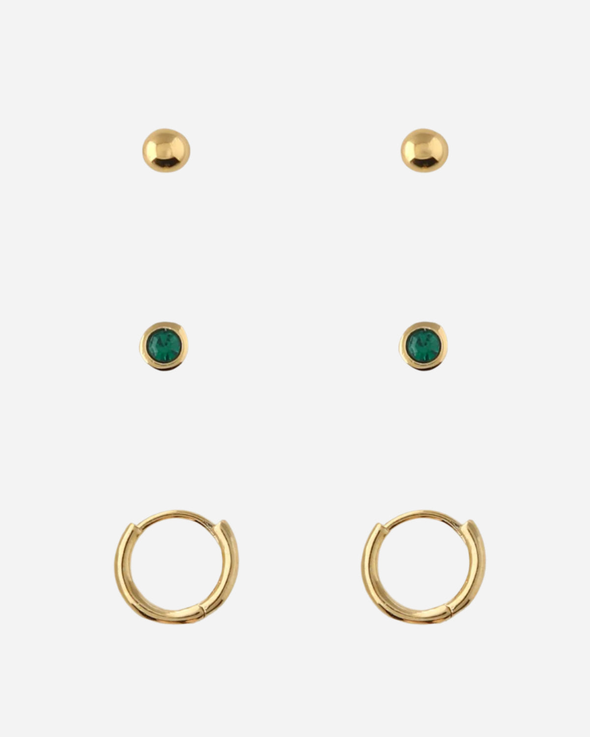 Set of gold earrings with green gemstones on a white background