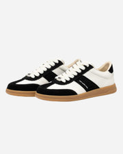 Black and white trainers with white laces and brown sole