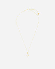 Gold necklace with a small pendant on a white background