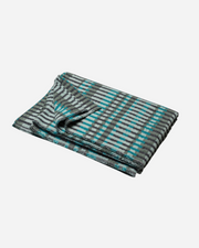 Folded blanket with blue and gray stripes on a white background