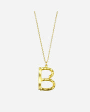 Gold necklace with a letter 'B' pendant on a white background