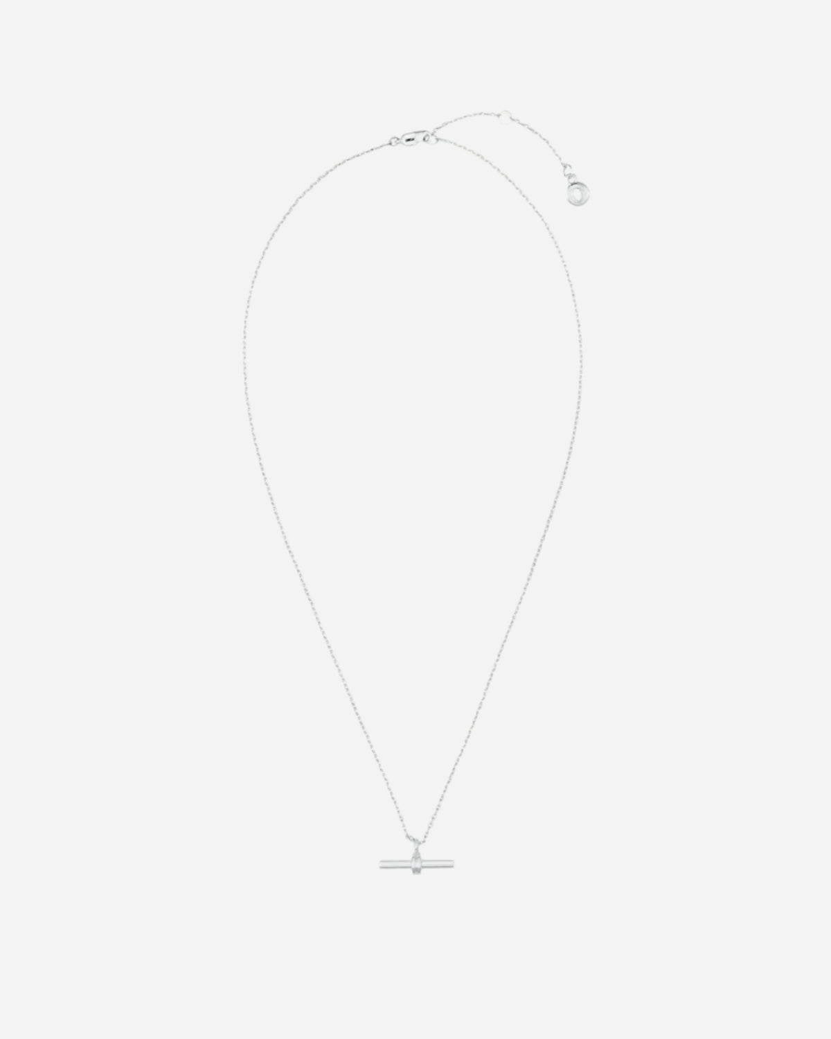 Silver necklace with a small pendant on a white background