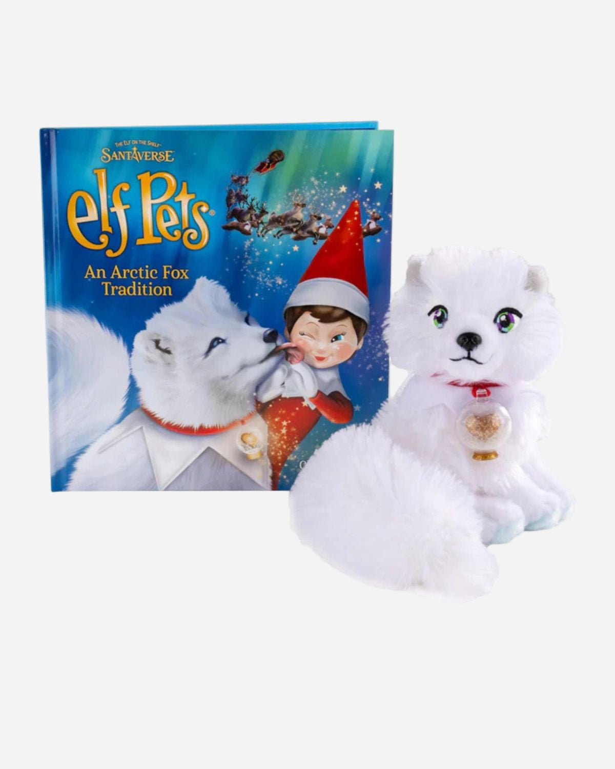 Plush toy resembling an arctic fox with a book titled 'Elf Pets' on a white background