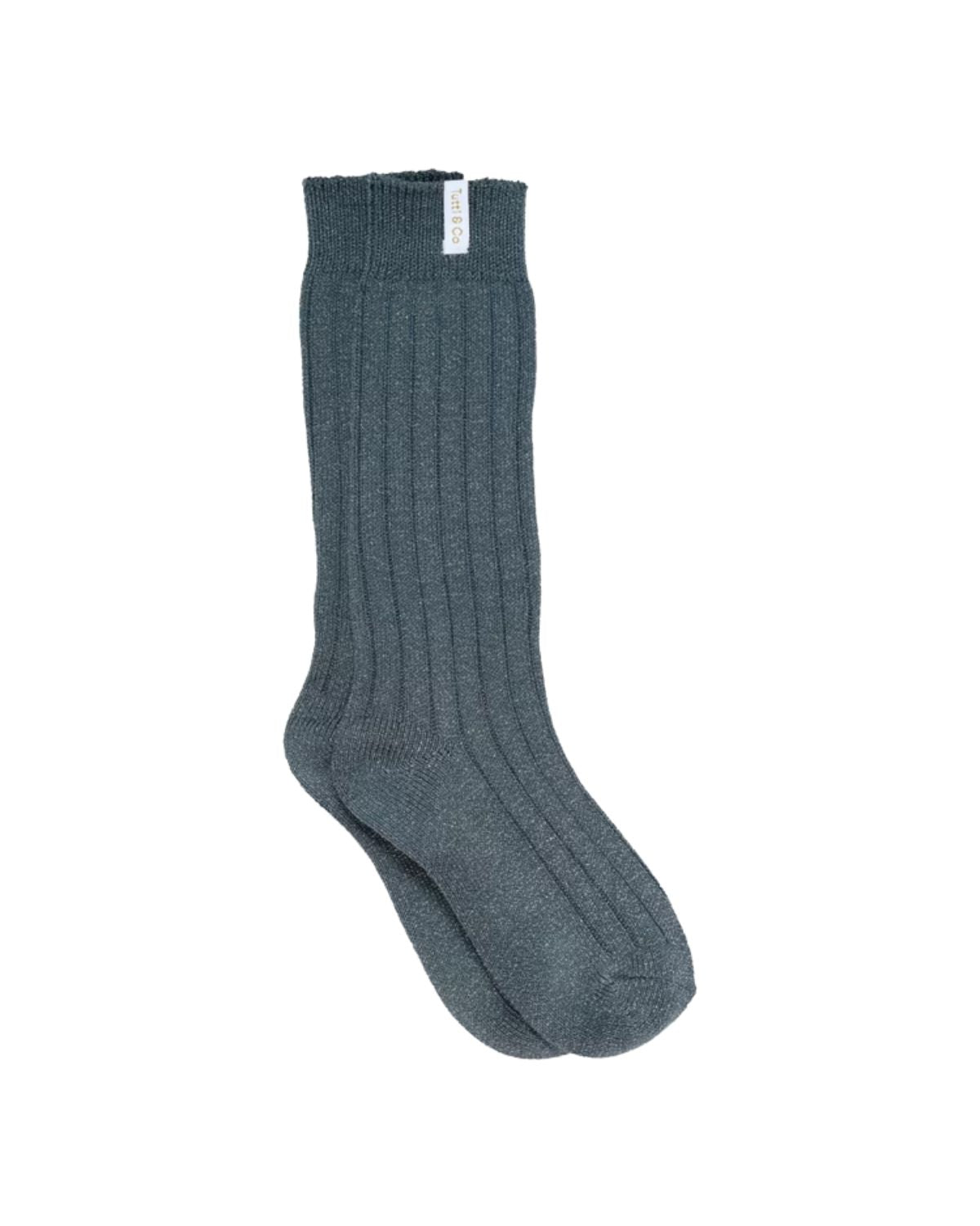 Dark green sock on a white background