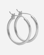 Pair of silver hoop earrings on a white background