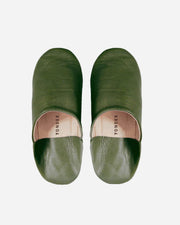 Pair of green slippers with 'Yonder' branding on a white background