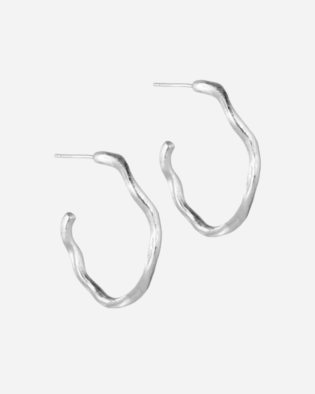 Silver wavy hoop earrings on a white background