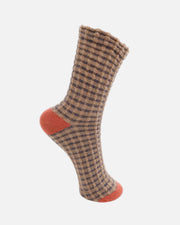 A single mid-calf sock with a brown and beige checkered pattern, featuring solid rust-orange heels and toes, shown against a plain white background.