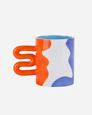 Colorful mug with a unique handle design on a white background