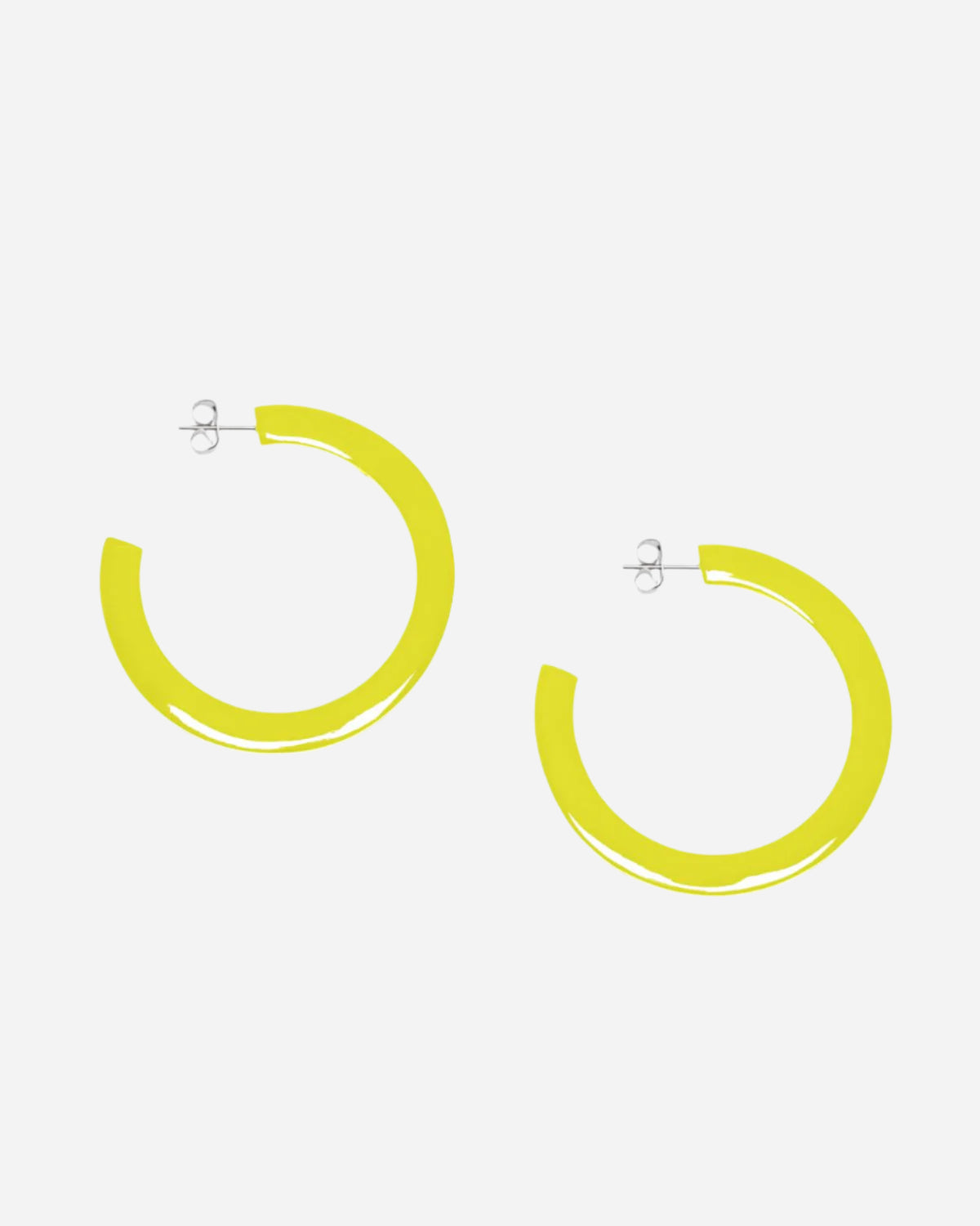 Yellow hoop earrings on a white background