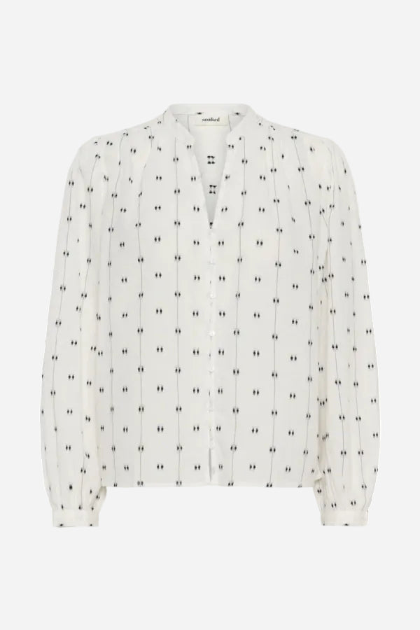 White blouse with black pattern on a white background
