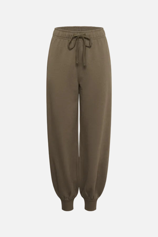 A pair of relaxed-fit jogger pants in a solid taupe-brown color, featuring an elastic waistband with a drawstring and ribbed cuffs at the ankles, shown against a plain white background.