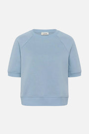 Light blue sweatshirt with a brand label on a white background