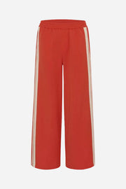 Red pants with white stripes on a white background