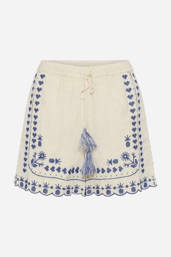 Beige shorts with blue floral embroidery and a tassel on a white background