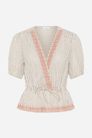 Striped blouse with pink accents on a white background