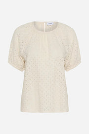 Beige blouse with small patterns on a white background