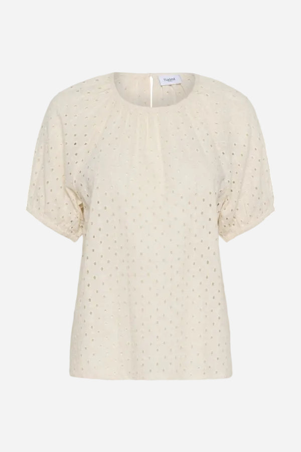 Beige blouse with small patterns on a white background