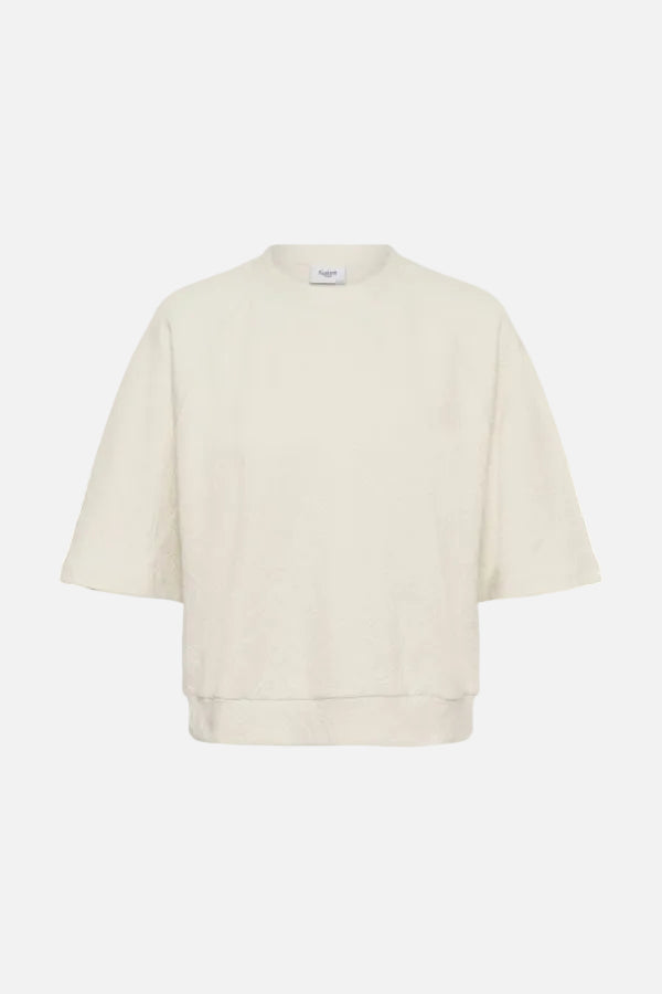 An off-white cotton crewneck sweatshirt with elbow-length sleeves, shown flat against a white background.