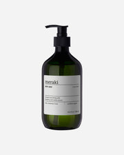 A pump bottle of Meraki Linen Dew body wash with a white label.