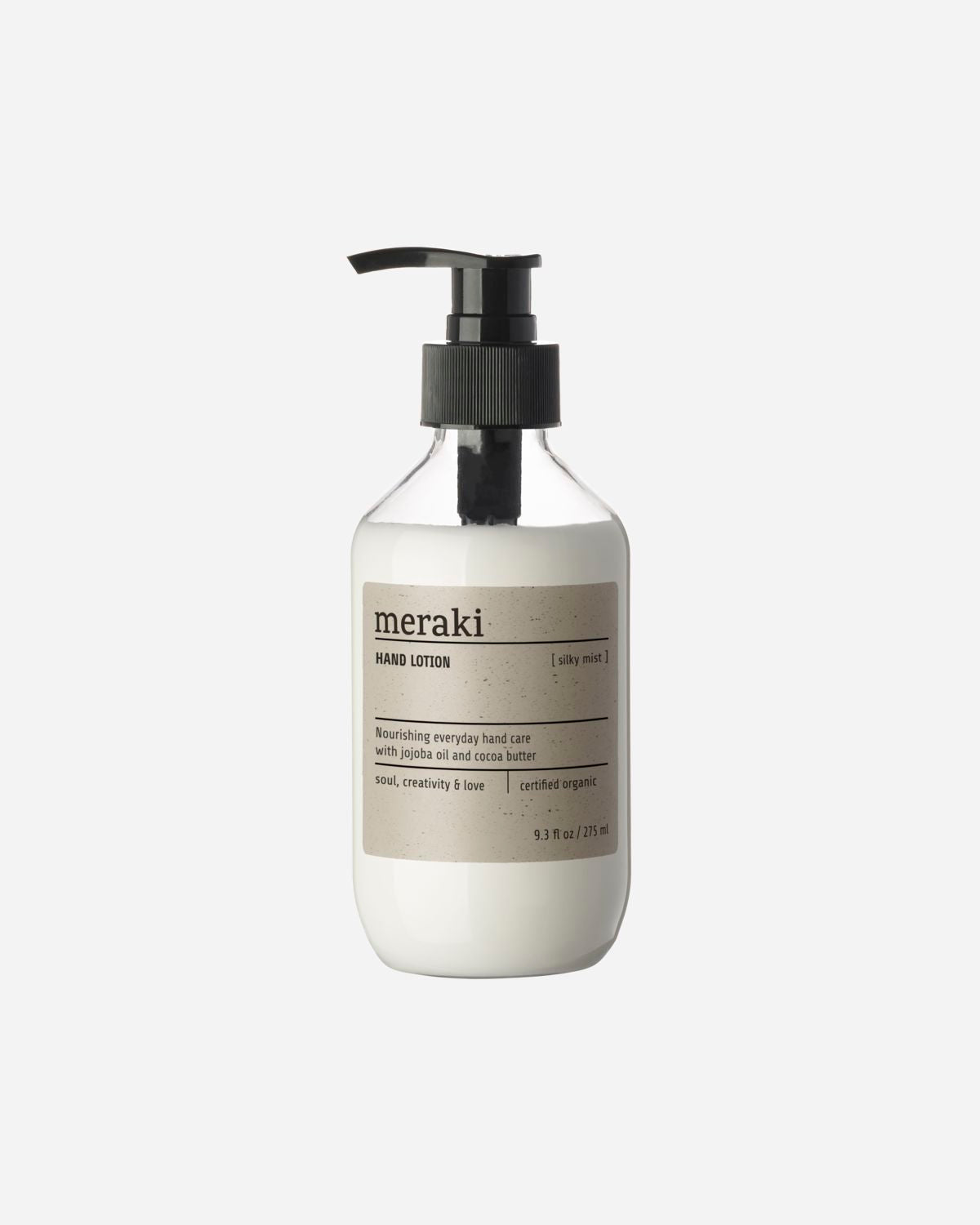 A pump bottle of Meraki hand lotion with a white label.
