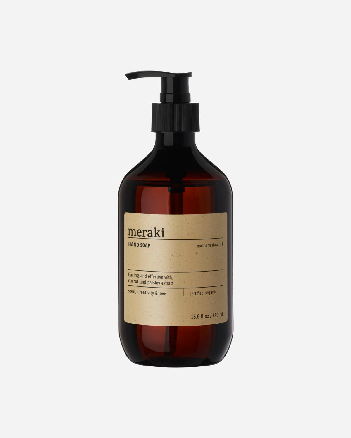 A clear pump bottle of Meraki hand soap with a brown label.