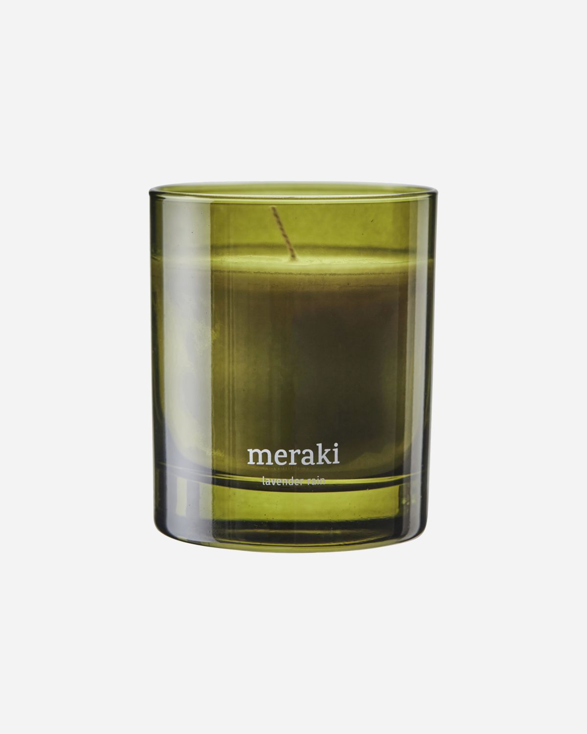 A green-colored glass jar with a scented candle inside