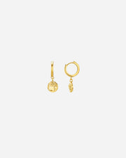 Gold hoop earrings with spherical charms on a white background