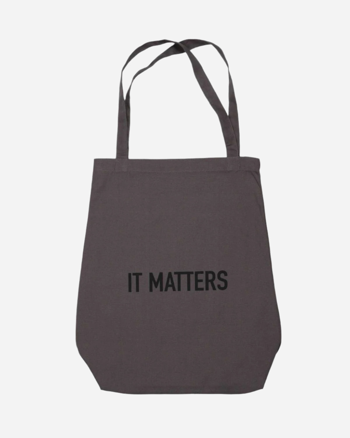 Gray tote bag with 'IT MATTERS' text on a white background