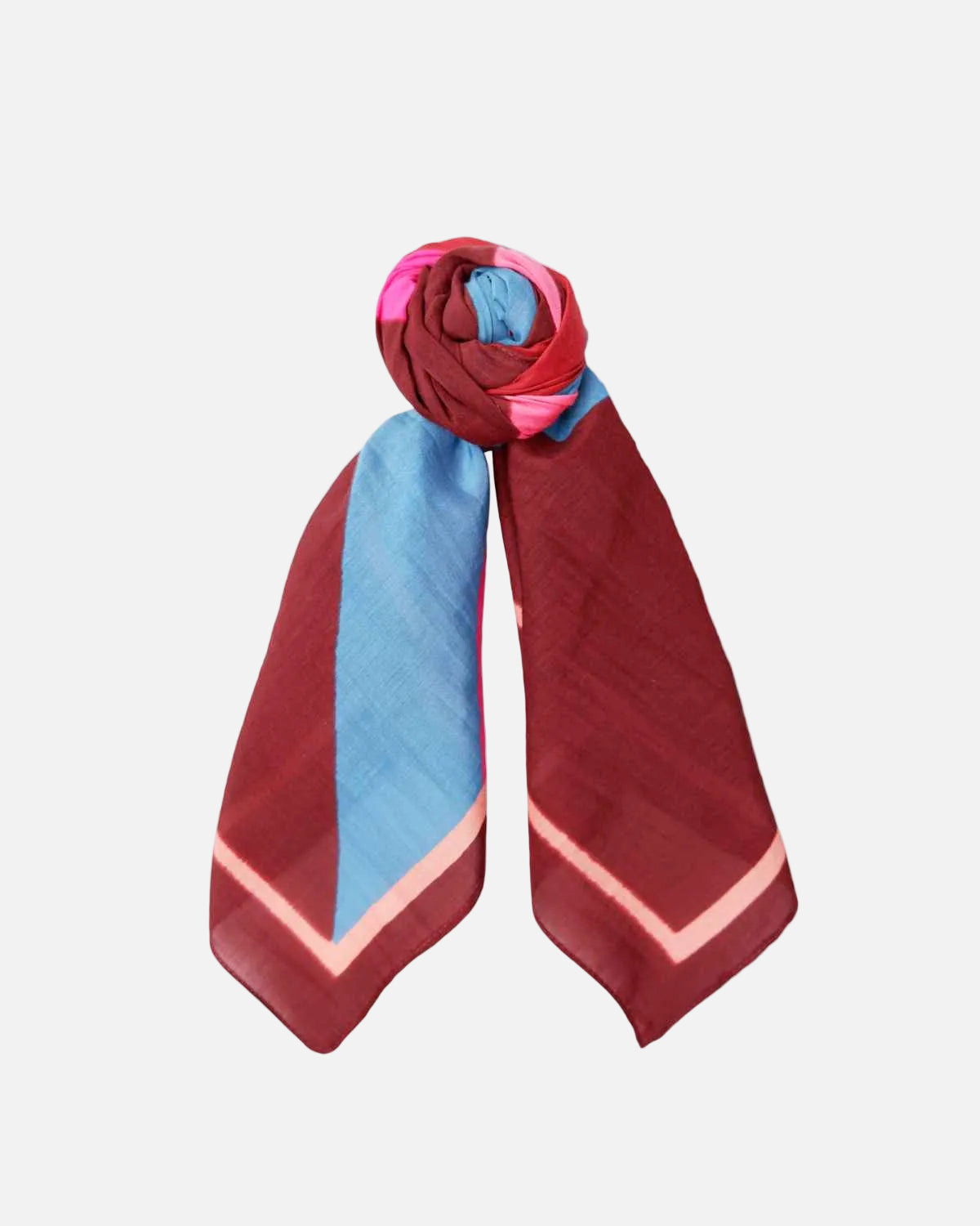 A lightweight silk scarf with a geometric color-blocked pattern in burgundy, light blue, pink, and red, styled in a loop on a plain white background.