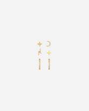 Set of gold earrings on a white background