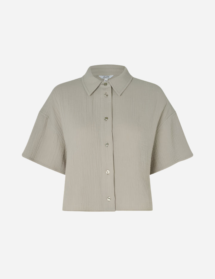 Beige short-sleeve shirt on a white background