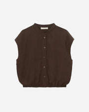 Brown sleeveless shirt on a light gray background
