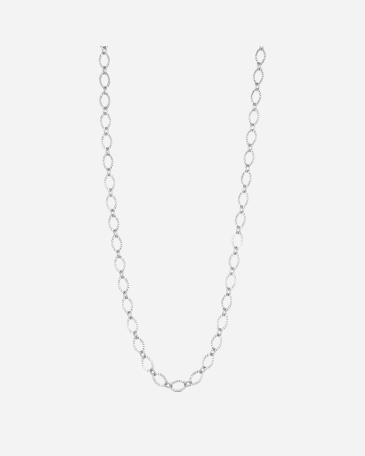 Silver chain necklace on a light gray background